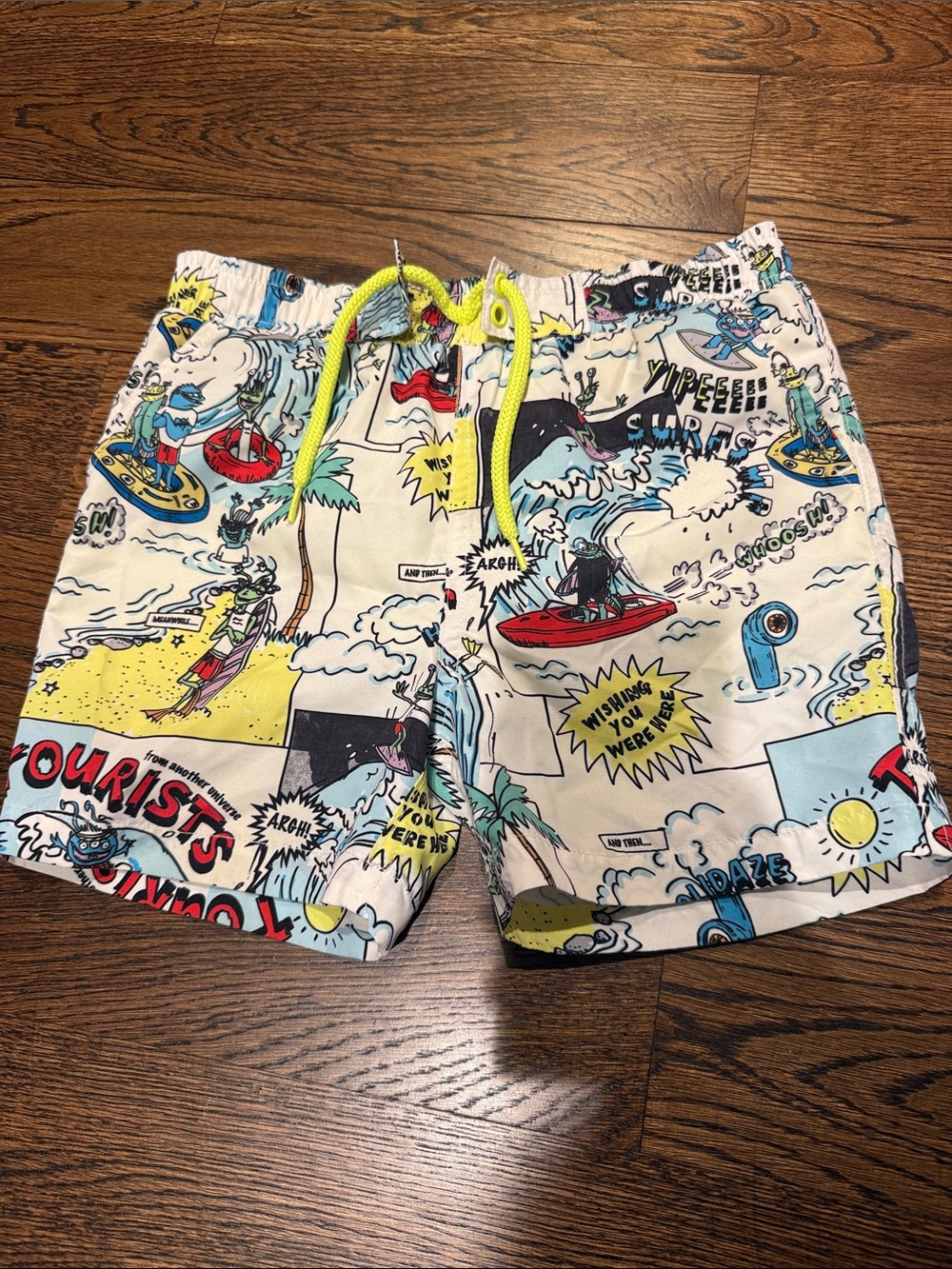Stella McCartney Boy’s White Comic-Print Swim Shorts with Yellow Drawstring